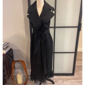 Vest with detachable feathers